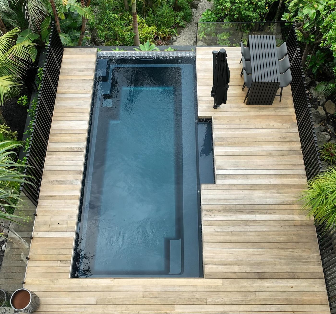Custom deck beside a pool