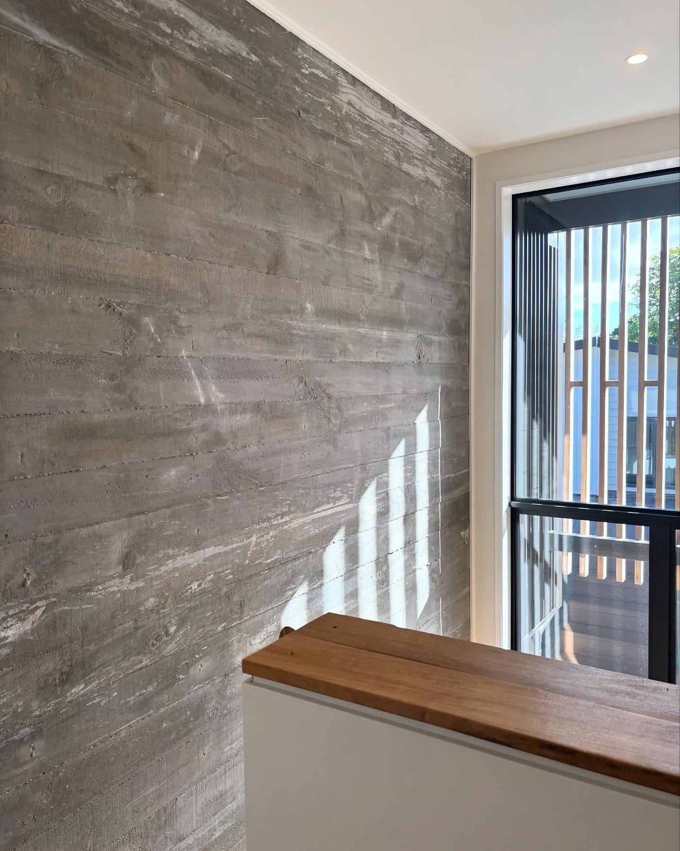 Two-storey in-situ concrete feature wall
