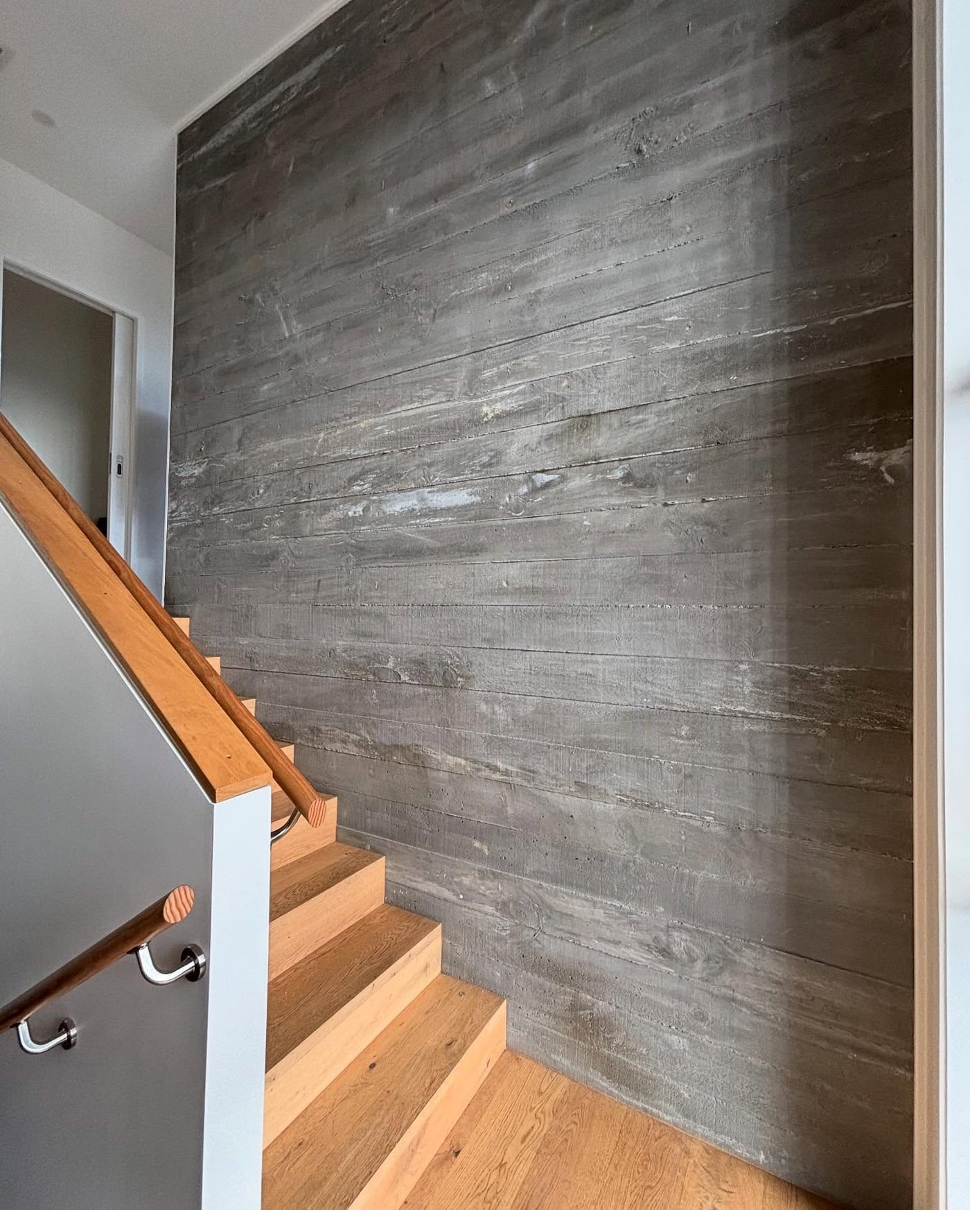 Rough sawn timber texture in concrete wall